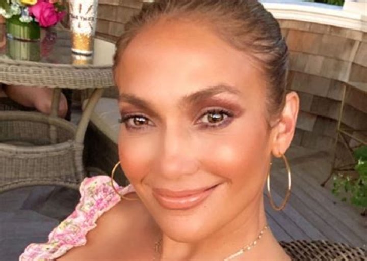 Jennifer Lopez Is Sun Kissed In LoveShackFancy Dress As She Announces New Makeup Line